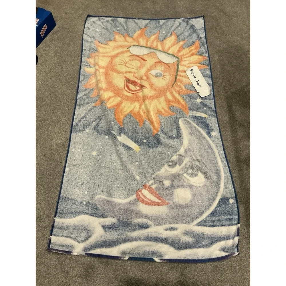 Vintage Copa Crescent celestial faces beach towel featuring a sun & moon design